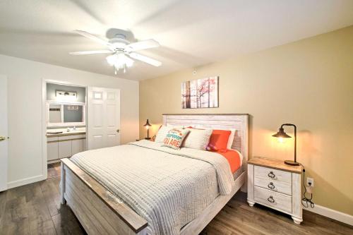 a bedroom with a bed and a ceiling fan at Walk-In Condo Amenities, 3 Mi to Branson Landing! in Branson