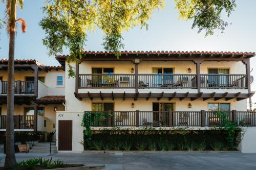 a building with balconies on the side of it at Palmoro House in Santa Barbara