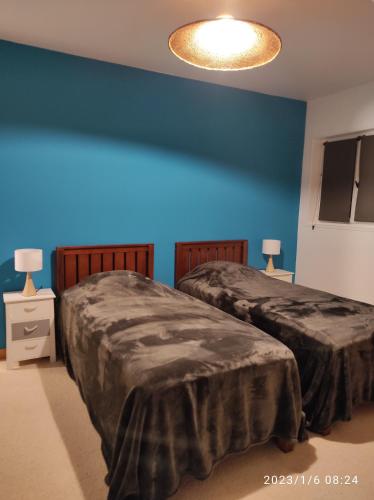 Katil atau katil-katil dalam bilik di Er Mervent Maison de vacances