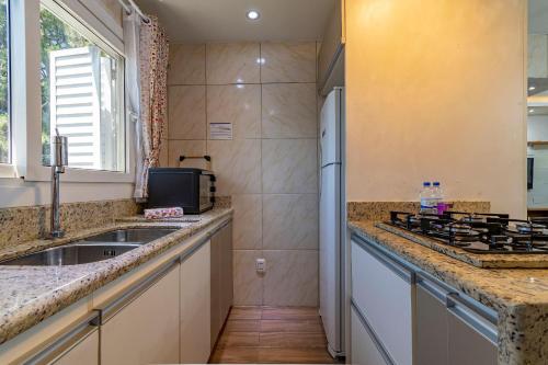 Køkken eller tekøkken på Rosa Casa Geminada Villa Mariana