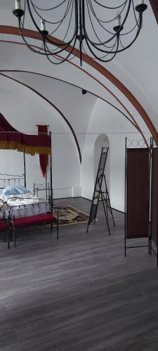 a room with a bed and a ladder in it at Templerhaus Boppard in Boppard