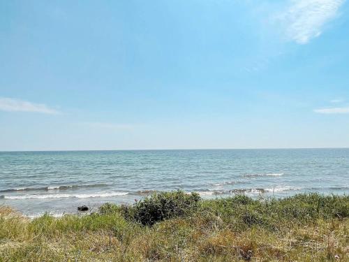 a view of the ocean from a sandy beach at 8 person holiday home in Beddingestrand-By Traum in Beddinge Strand