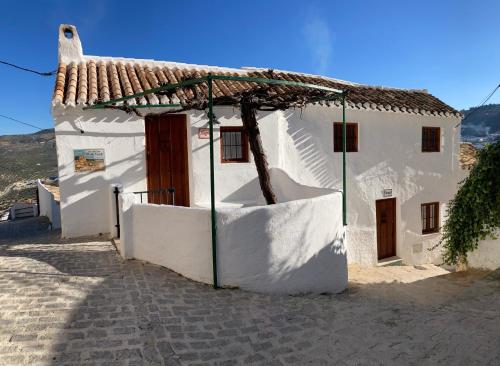 モンテフリオにあるLas casillas de la Villa: TANGOの藁葺き屋根の白屋根