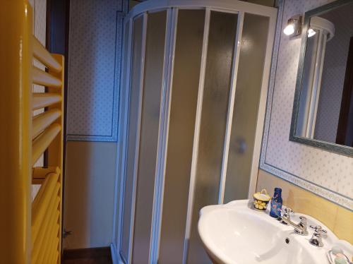 a bathroom with a sink and a shower at Villa Camelia Tuscany in Pescia