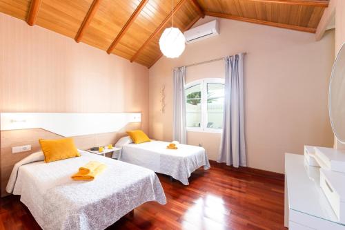 Posteľ alebo postele v izbe v ubytovaní Villa Jusapa by Villa Plus