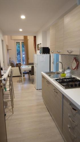 a kitchen with a stove and a counter top at OASI FELICE in Levanto