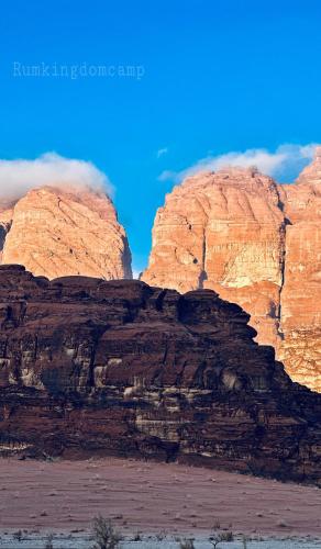 a view of a rocky mountain with a blue sky at Rum Kingdom Camp in Wadi Rum