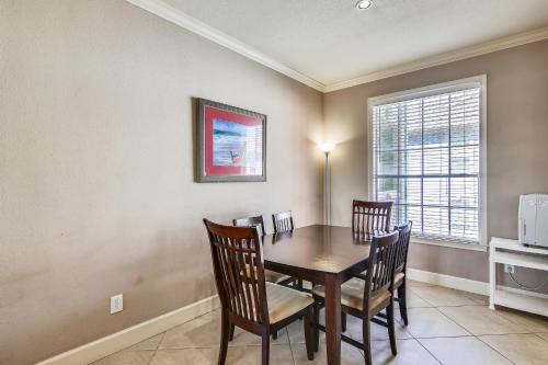 a dining room with a table and chairs at Dawn 625 in Galveston