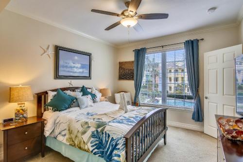 a bedroom with a bed and a ceiling fan at Dawn 722-Poolside Paradise in Galveston