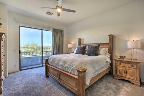 a bedroom with a bed and a large window at Elegant Scottsdale Townhome with Heated Pool! in Scottsdale