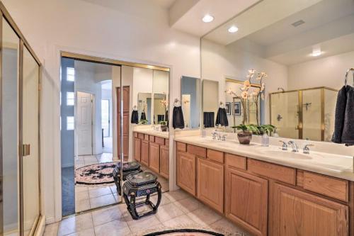 a bathroom with two sinks and a large mirror at Elegant Scottsdale Townhome with Heated Pool! in Scottsdale