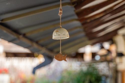 a bell hanging from the ceiling of a store at Sarangroo in Jeonju