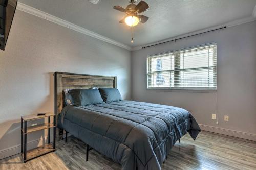 a bedroom with a bed and a ceiling fan at Inviting Gulfport Home with Private Pool and Yard in Gulfport