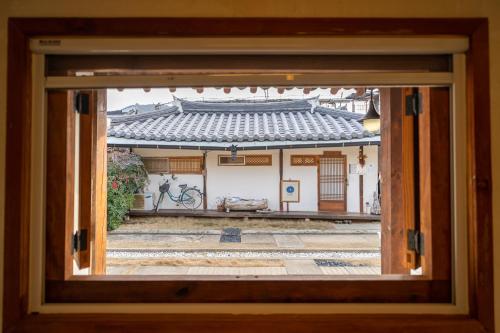 a view of a building through a window at Sarangroo in Jeonju