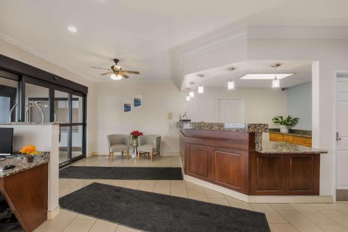 a large room with a kitchen and a living room at MainStay Suites Joliet I-80 in Joliet