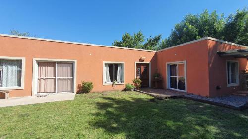 a house with a yard in front of it at Los Cardales Mia in Los Cardales