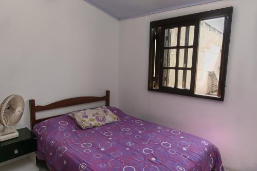 Katil atau katil-katil dalam bilik di Casa com churrasqueira prox a Praia de Cidreira RS