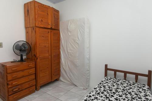 Katil atau katil-katil dalam bilik di Casa com churrasqueira prox a Praia de Cidreira RS