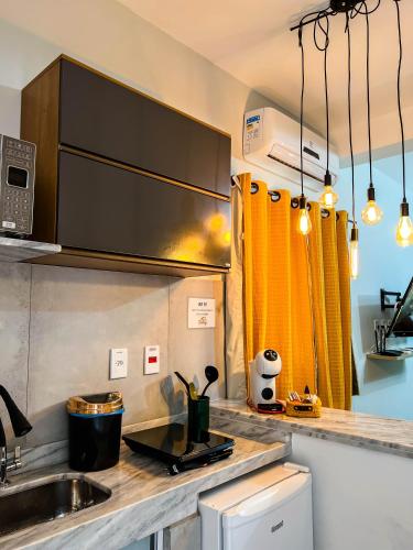 a kitchen with a sink and a counter top at Pousada dos Sonhos - MP in Miguel Pereira