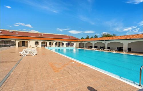 a large swimming pool in a building at Pet Friendly Home In Tranekær With Wifi in Tranekær