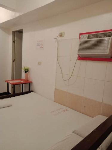 Postel nebo postele na pokoji v ubytování WJV INN Humay-humay