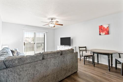 a living room with a couch and a table at New King Bed Beautifully Updated KMC1312 in Manhattan