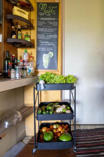 a rack of fruits and vegetables on a shelf at KIA ORA Lodge in Afaahiti