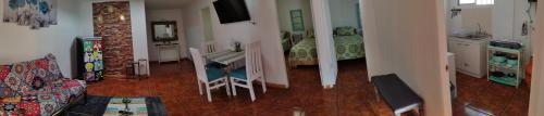 a living room with a couch and a table in a room at MatSofy_Apartamento in Santiago