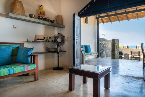 Χώρος καθιστικού στο Blue Parrot Beach Villa