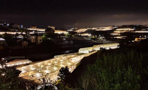 a view of a city at night at Nhà Sói Homestay Da Lat in Da Lat