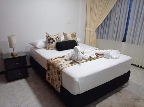 Кровать или кровати в номере Hostal Sol Naciente