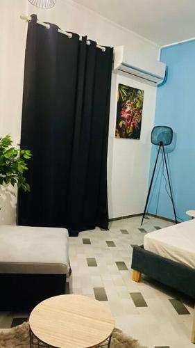 Posezení v ubytování Urban Zen Appart Spacieux studio atypique avec bain a remous proche de tout