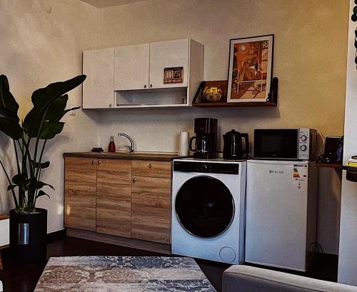 a kitchen with a washing machine and a counter at Triplex house with Bridge view in Istanbul