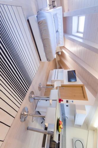 an attic office with a desk and a window at Corte Maggiore in Ravenna