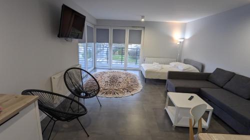 Posteľ alebo postele v izbe v ubytovaní Apartamenty Słoneczna 42