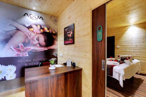 a room with a poster of a woman on the wall at Sumitel Vista 800m from Mall Road in Darjeeling