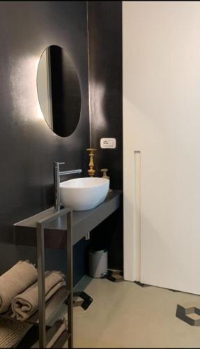 a bathroom with a sink and a mirror at Villa La Torretta Luxury B&B - Adults Only - in Rimini