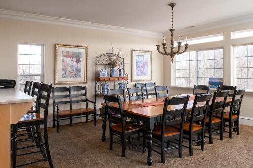 a dining room with a table and chairs at Family Getaway-Hot Tub, Ice Castles & Tubing HS home in Midway