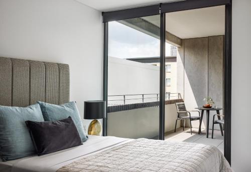 Ein Bett oder Betten in einem Zimmer der Unterkunft Punthill Parramatta