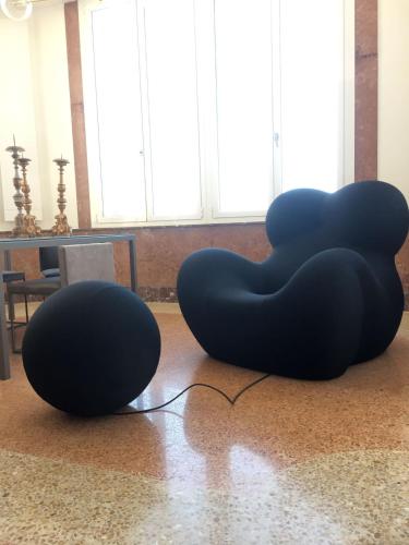 two black spheres sitting on the floor in a room at Villa La Torretta Luxury B&B - Adults Only - in Rimini