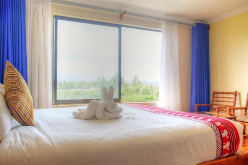 Postel nebo postele na pokoji v ubytování Peaks Hotel Nanyuki