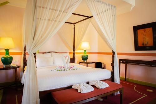 Ένα ή περισσότερα κρεβάτια σε δωμάτιο στο Villa Maly Boutique Hotel