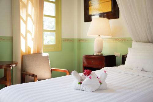 Ένα ή περισσότερα κρεβάτια σε δωμάτιο στο Villa Maly Boutique Hotel