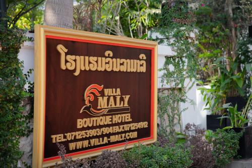 ein Zeichen, das auf Nachhaltigkeit deutet in der Unterkunft Villa Maly Boutique Hotel in Luang Prabang