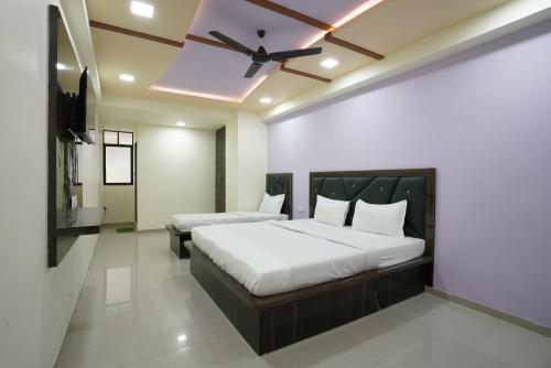 Ένα ή περισσότερα κρεβάτια σε δωμάτιο στο Hotel GGC INN