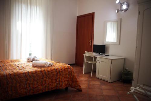 a bedroom with a bed with two teddy bears on it at B&B Giulia Caltanissetta in Caltanissetta