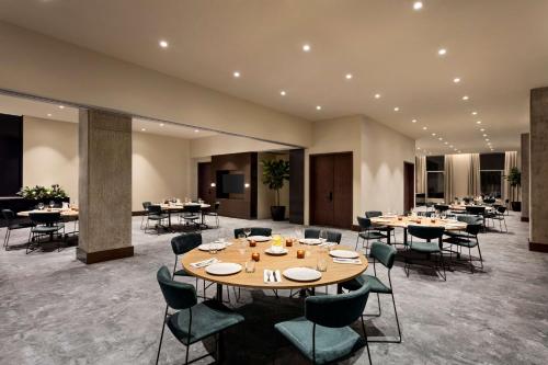 a large dining room with tables and chairs at Hyatt Centric Montreal in Montréal