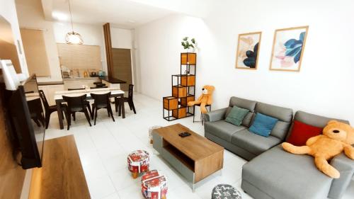 a living room with a couch and a table at The Quintet Condominium 3-1 in Tanah Rata