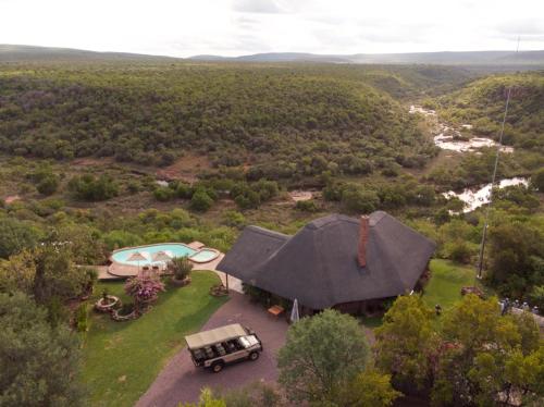 an aerial view of a house with a car parked in the yard at Magari Safari Villa in Vaalwater