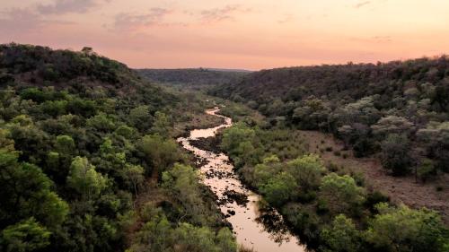an aerial view of a river in a forest at Magari Safari Villa in Vaalwater